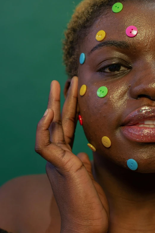 a woman with polka dots on her face, by Olivia Peguero, trending on pexels, afrofuturism, lgbtq, her face in discs, candy girl, markings on his face