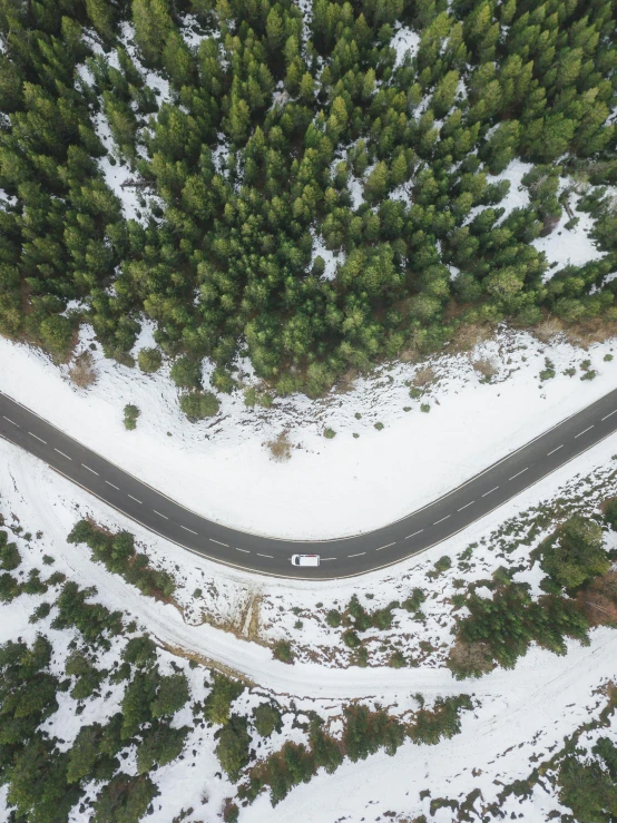 a car driving down a snow covered road, by Terese Nielsen, pexels contest winner, land art, high angle uhd 8 k, 2 5 6 x 2 5 6 pixels, wide, educational