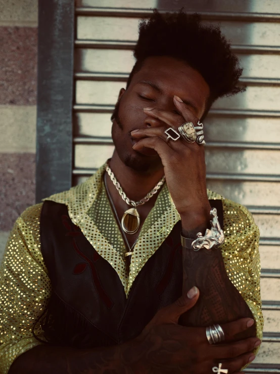 a close up of a person smoking a cigarette, an album cover, inspired by Xanthus Russell Smith, trending on pexels, afrofuturism, neck chains, gold suit, brown skinned, his palms are sweaty