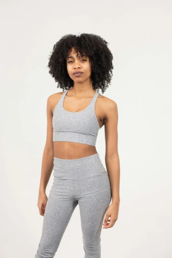 a woman in a grey sports bra top and leggings, inspired by John Luke, profile image, hemp, ashteroth, productphoto