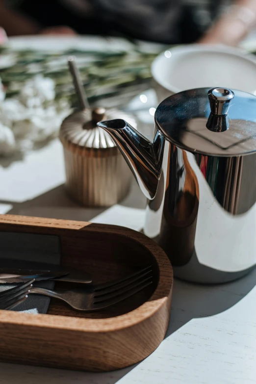 a tea pot sitting on top of a wooden tray, cutlery, stainless steel, award - winning details, thumbnail