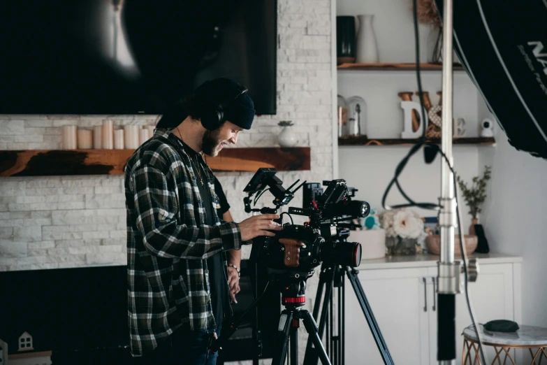 a man that is standing in front of a camera, trending on pexels, home video, low grain film, production ig studios, cinestill 400t