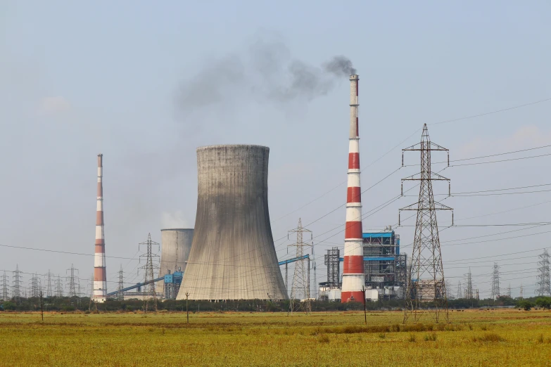 a nuclear power plant with smoke coming out of it, a portrait, by Adam Marczyński, shutterstock, sichuan, 15081959 21121991 01012000 4k, pylons, maintenance photo