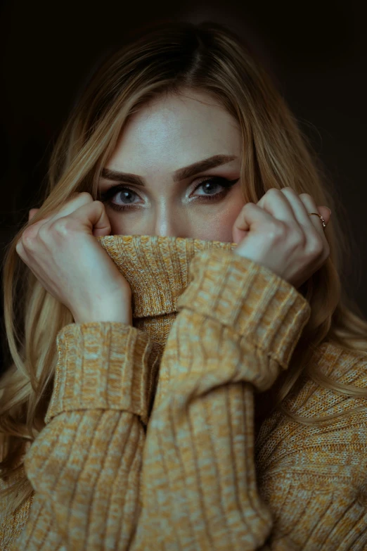 a woman covering her face with her hands, a picture, by irakli nadar, trending on pexels, aestheticism, blonde hair and large eyes, sweater, square, better known as amouranth