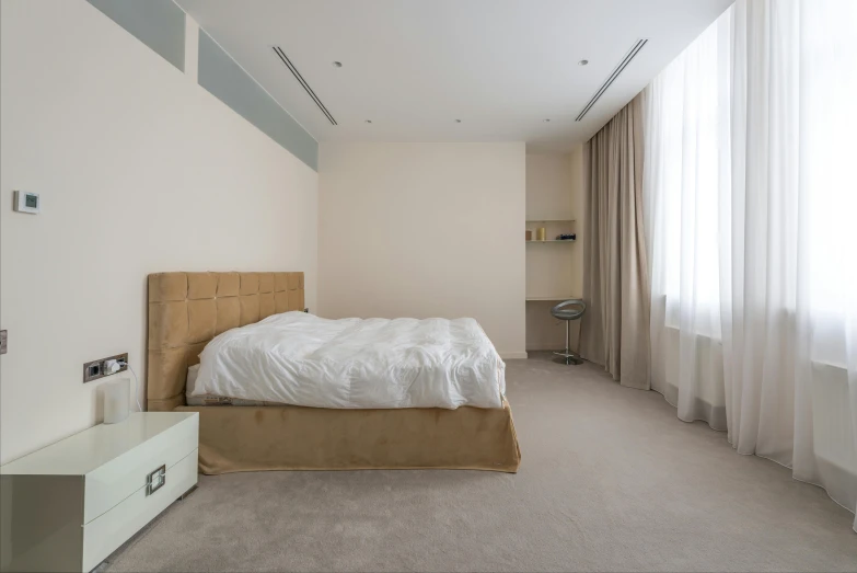 a bed sitting in a bedroom next to a window, an album cover, by Harvey Quaytman, unsplash, light and space, dubai, cream - colored room, city apartment, azamat khairov