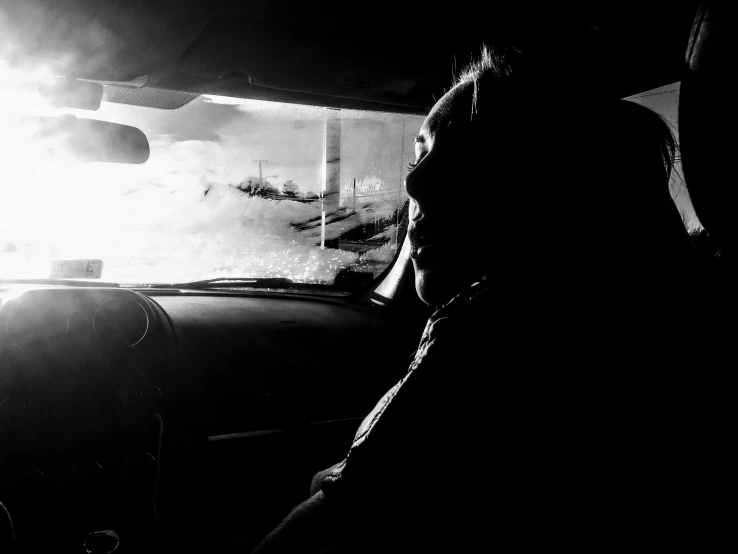 a black and white photo of a person in a car, a black and white photo, backlit, illustration », lowres, freezing