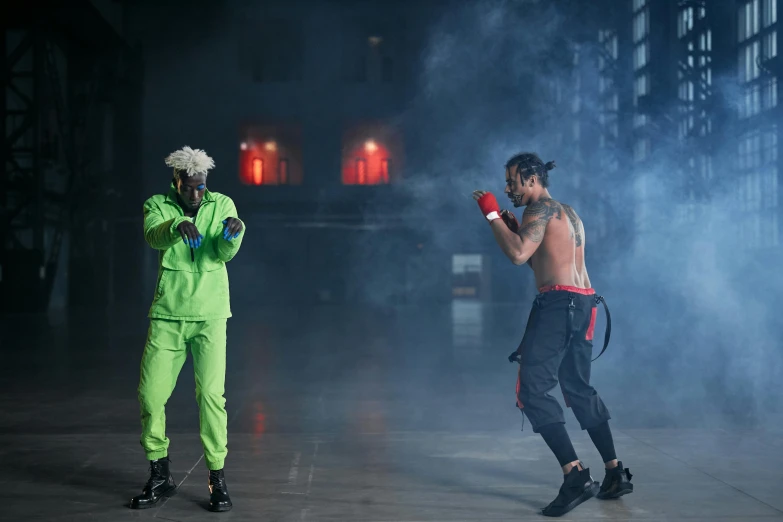 a couple of men standing next to each other on a stage, inspired by Daryush Shokof, pexels contest winner, figuration libre, ninja outfit, working out, green and red, die antwoord ( yolandi visser )