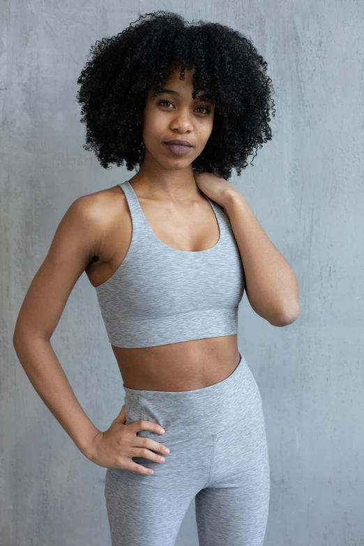 a woman standing with her hands on her hips, detailed sports bra, light grey mist, sza, curated collections