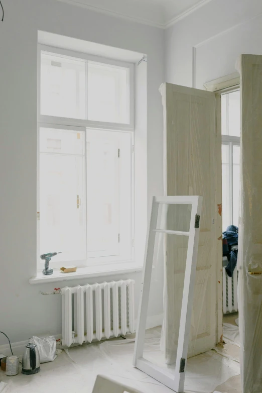 a room that has a ladder in it, inspired by Anna Füssli, pexels contest winner, arbeitsrat für kunst, radiator, under construction, cream - colored room, view from window