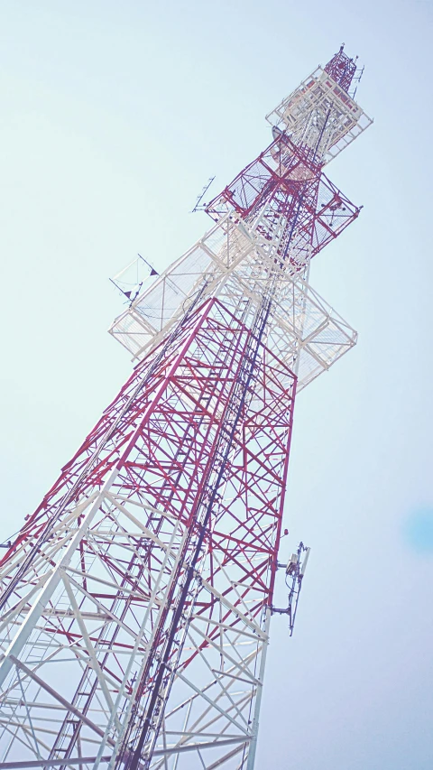 a cell phone tower with a blue sky in the background, by Adam Marczyński, pexels, conceptual art, jakarta, square, low detail, panels