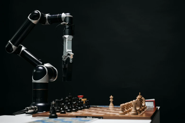 a robot playing a game of chess on a table, a portrait, unsplash, with a robotic arm, trending on dezeen, looking from side, ai biodiversity