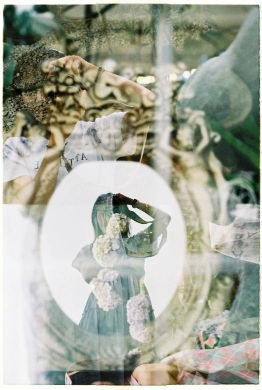 a reflection of a woman in a mirror, a polaroid photo, unsplash, qajar art, swirling scene, ((intricate)), wearing translucent veils, sea - green and white clothes