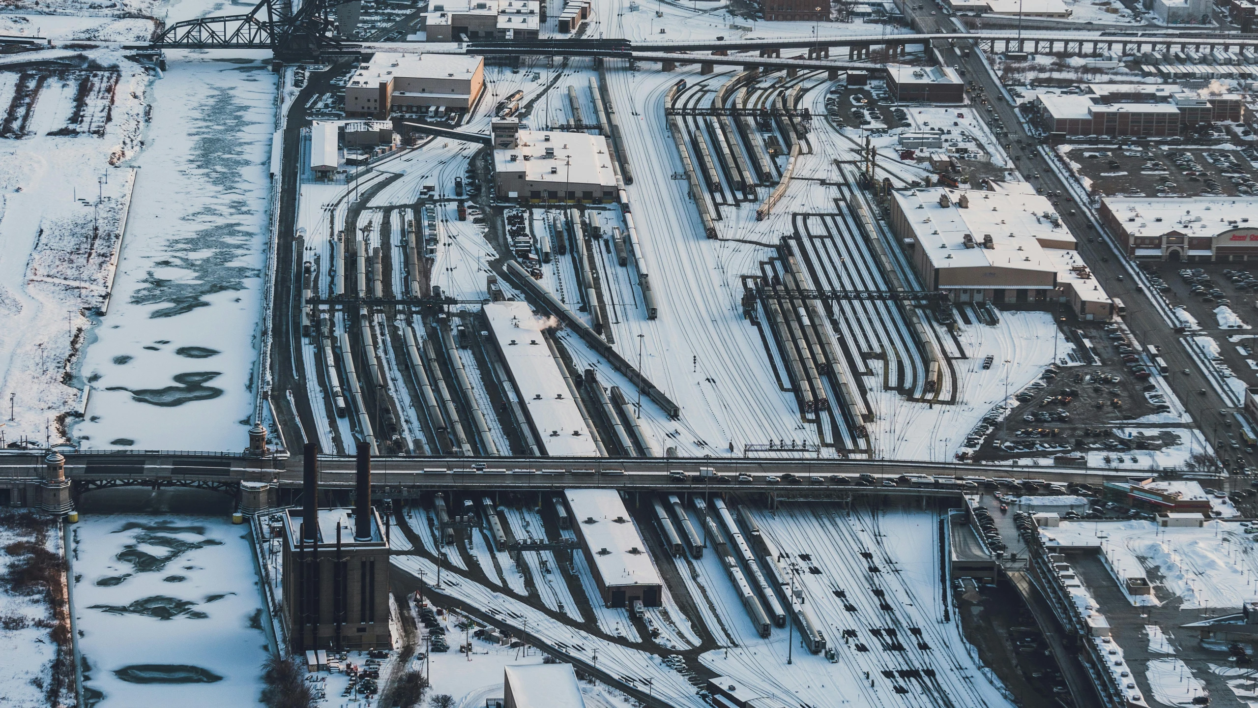 an aerial view of a train yard in the snow, inspired by Thomas Struth, pexels contest winner, minneapolis, portrait photo, high quality product image”