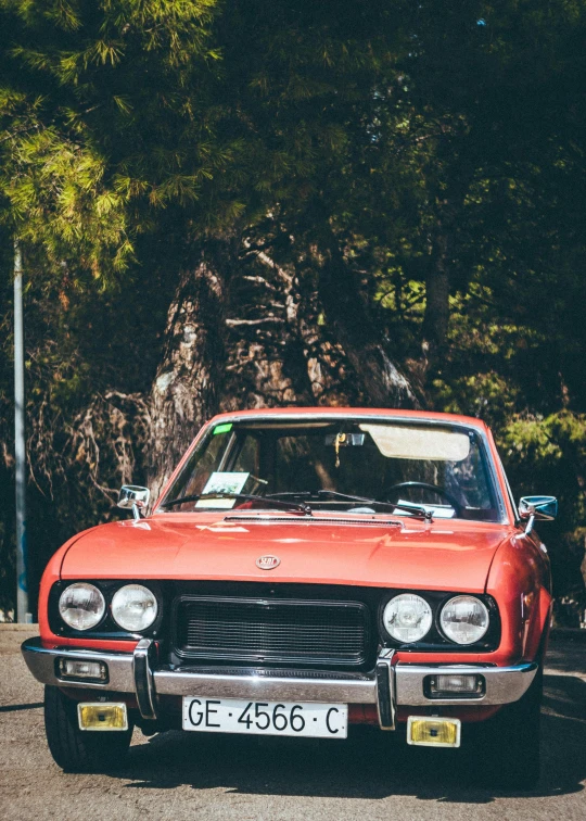 a red car is parked on the side of the road, an album cover, unsplash, renaissance, in karuizawa, profile image, 7 0 s photo, 🚿🗝📝