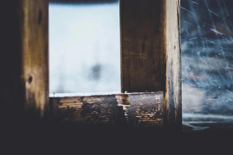 a close up of a window with a wooden frame, inspired by Elsa Bleda, unsplash, visual art, some dust in the air, background image, multiple stories