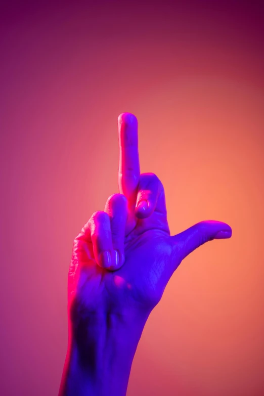 a close up of a person's hand with a finger up, by Adam Marczyński, synchromism, purple orange colors, red and blue neon, peace, conceptual