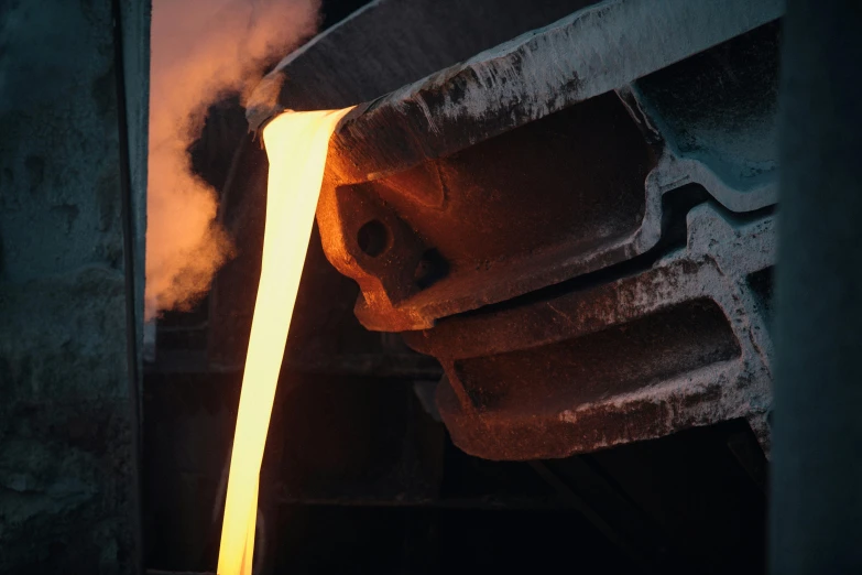 a close up of a piece of metal being poured, a picture, unsplash contest winner, factories, promo image, close to night, cast