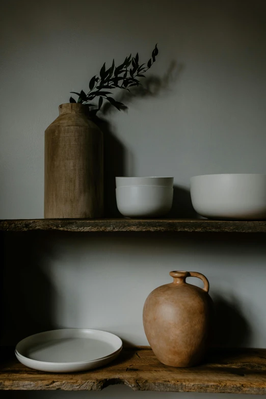 a brown vase sitting on top of a wooden shelf, inspired by Lewis Henry Meakin, trending on unsplash, large jars on shelves, bowl filled with food, clean soft lighting, plaster