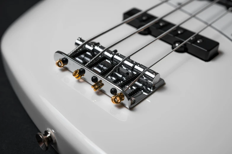 a close up of a white bass guitar, by Steve Prescott, unsplash, bauhaus, wires connected, ultra high detailed, 4 k detail, hooked nose and square jaw