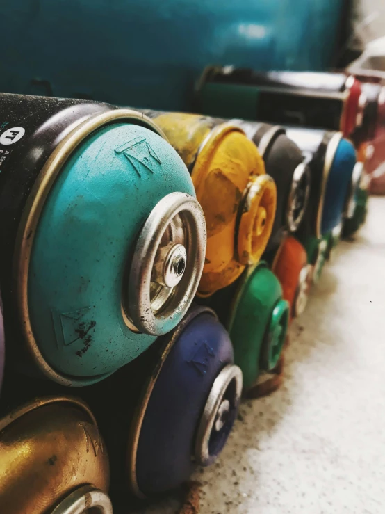 a group of spray cans sitting next to each other, pexels contest winner, colorful details, grainy, sustainable materials, ( colorful )