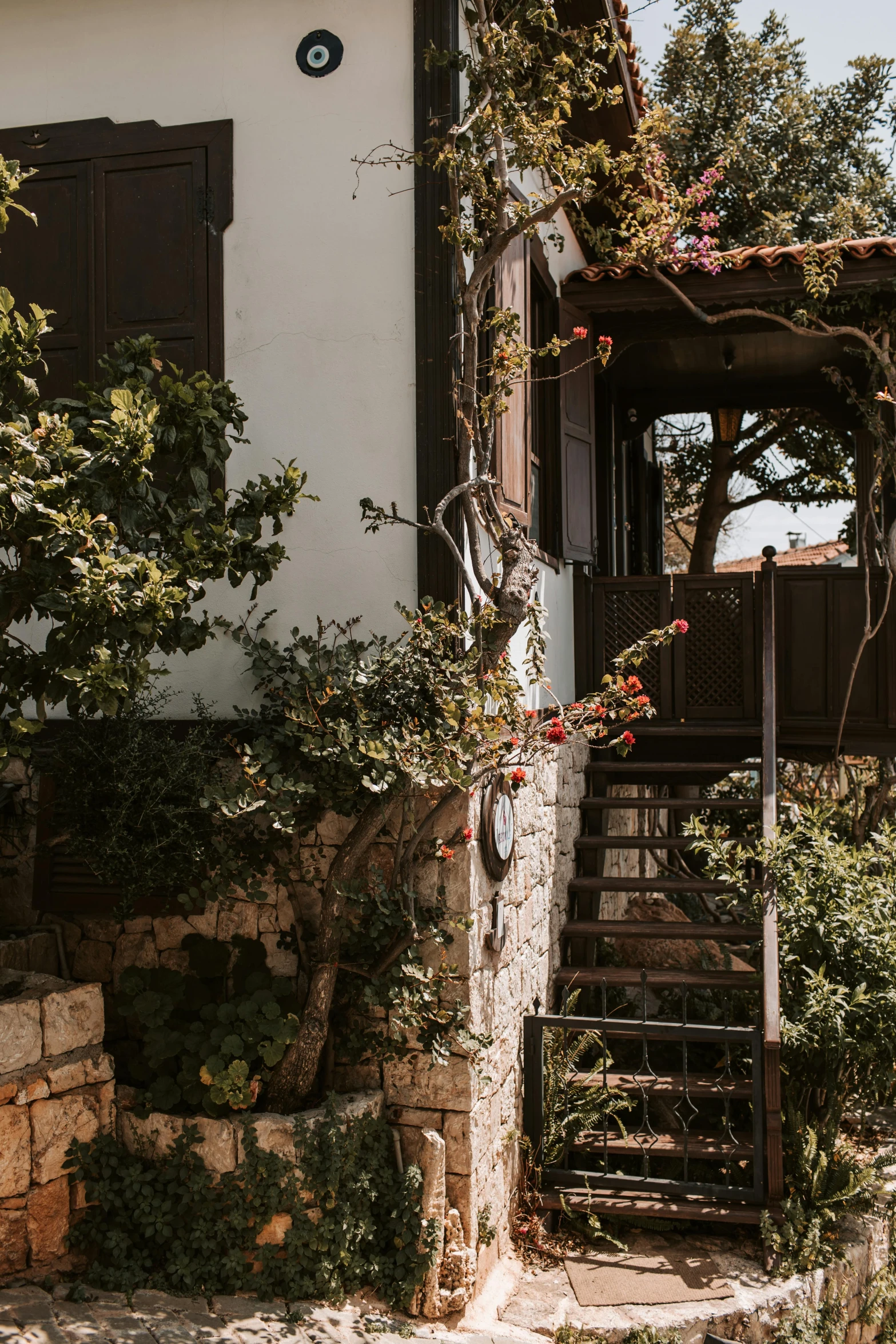 a couple of stairs going up to a building, pexels contest winner, garden with fruits on trees, cyprus, rustic setting, jen atkin