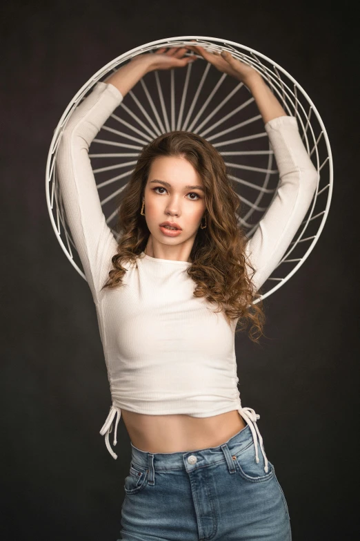 a beautiful young woman posing in front of a black background, by Simon Ushakov, wheels, white backdrop, wearing crop top, 15081959 21121991 01012000 4k