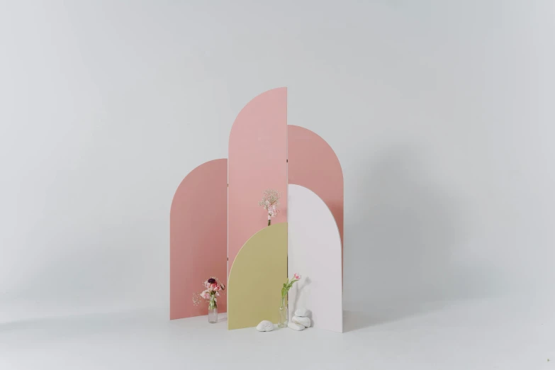 a couple of books sitting on top of a table, an abstract sculpture, by Marion Ancrum, unsplash, pink arches, part of the screen, in front of white back drop, pastel palette silhouette