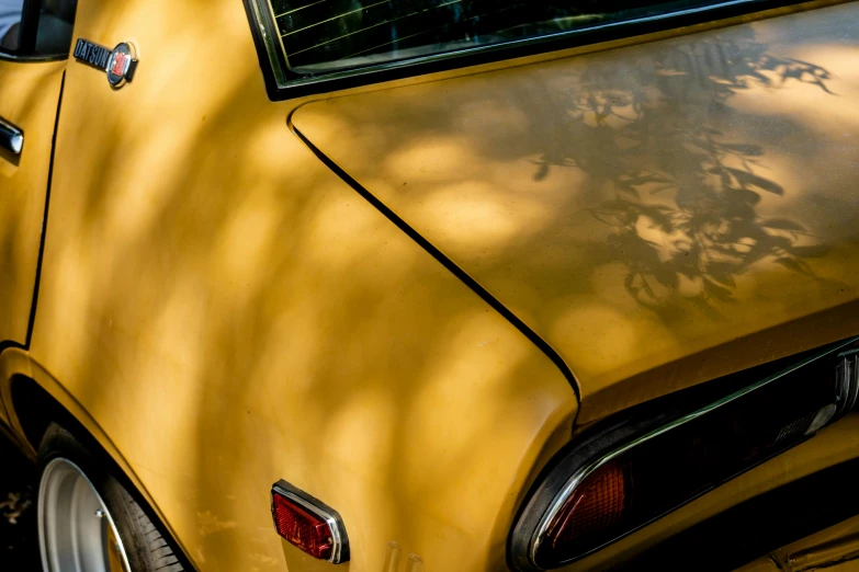 a yellow car parked on the side of the road, pexels contest winner, photorealism, back light, 70s colors, detail shots, ochre