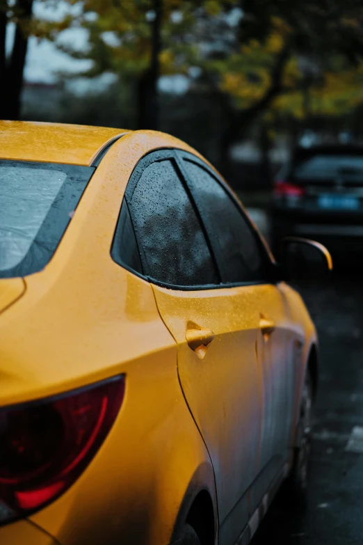 a yellow car parked on the side of the road, pexels contest winner, renaissance, just after rain, square, professional paint job, back