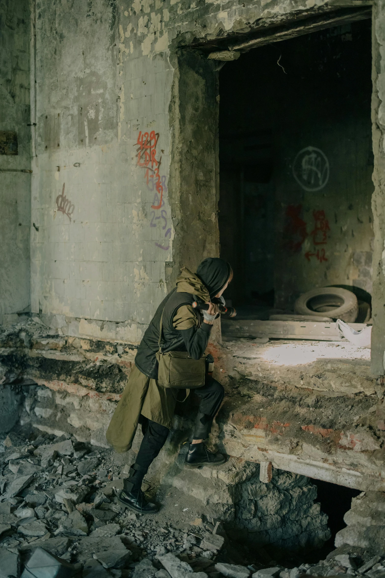 a man in a trench coat sitting on a window sill, a photo, unsplash contest winner, war in ukraine, post apocalyptic building, ( ( theatrical ) ), slide show