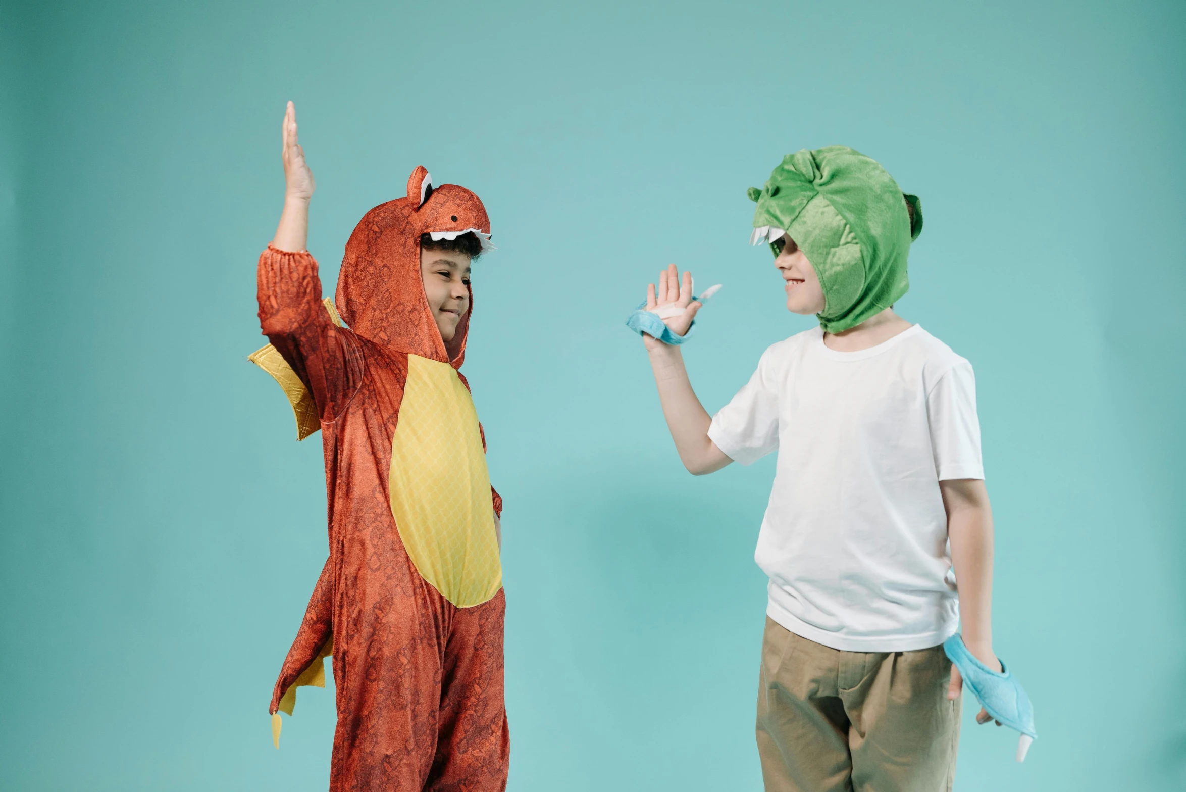 a couple of kids standing next to each other, pexels contest winner, joe biden dressed as a dinosaur, greeting hand on head, avatar image, preparing to fight