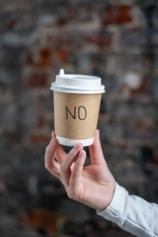 a person holding a coffee cup with no written on it, by Nina Hamnett, excessivism, no restaurant, thumbnail, protective, do