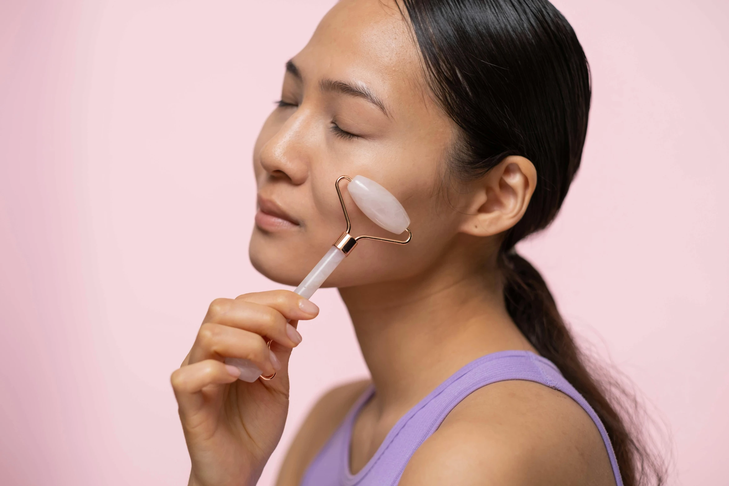 a woman brushes her face with a brush, trending on pexels, wearing translucent sheet, pink, woman is curved, yanjun chengt