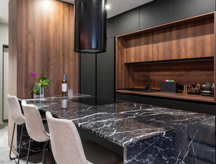 a kitchen with a marble counter top and chairs, by Niko Henrichon, pexels contest winner, hyperrealism, black marble, são paulo, wood accents, hr geiger design