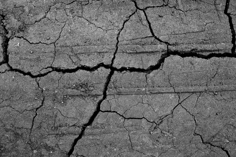 a black and white photo of cracked concrete, by Mirko Rački, auto-destructive art, wallpaper mobile, tar roads, shaded, soil