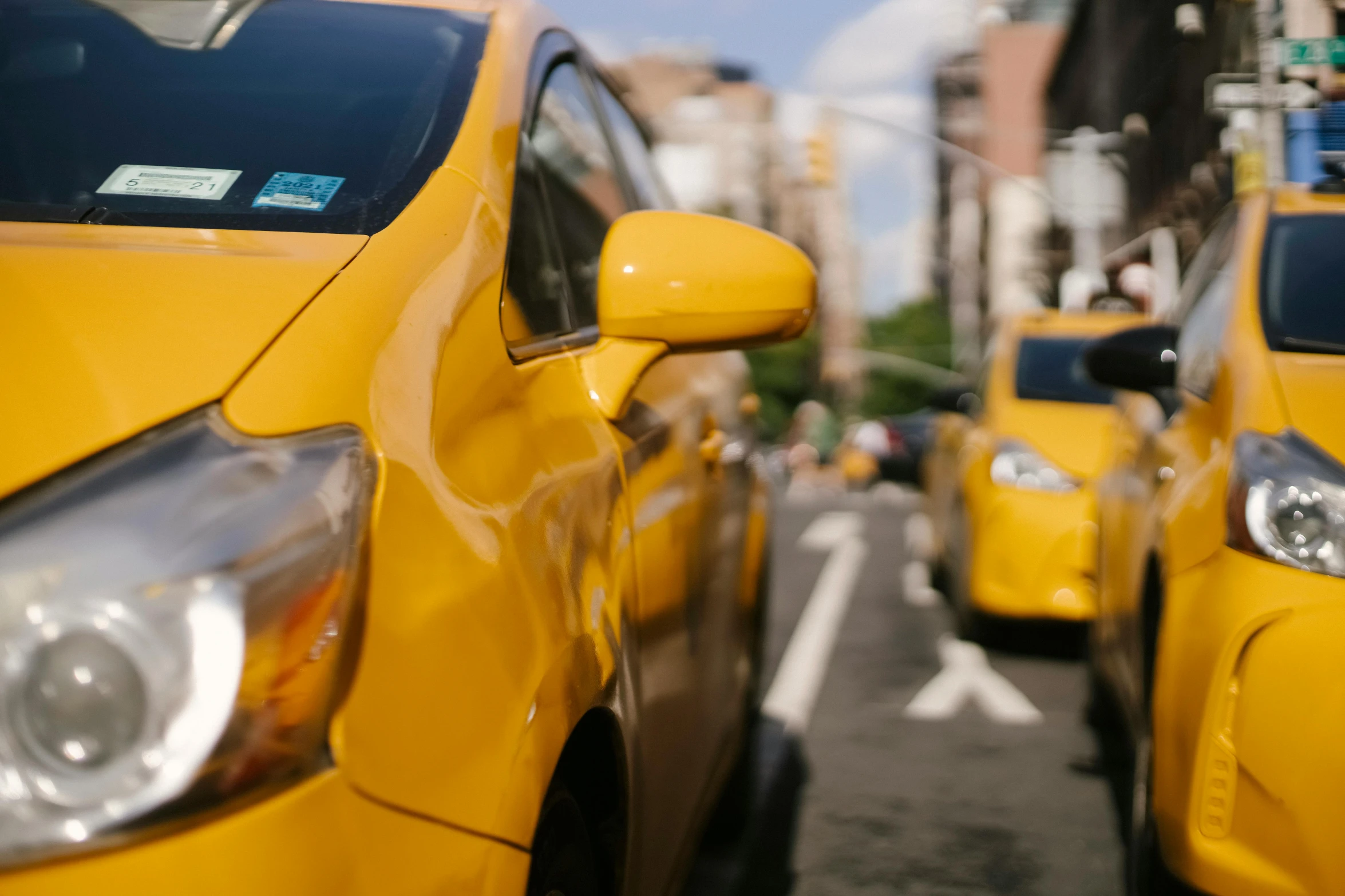 a row of yellow taxi cabs on a city street, pexels contest winner, 🦩🪐🐞👩🏻🦳, close up shot from the side, avatar image, street of new york