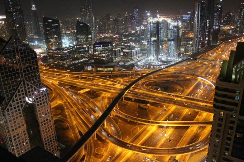 an aerial view of a city at night, pexels contest winner, hurufiyya, dubai, freeway, thumbnail, deeply hyperdetailed