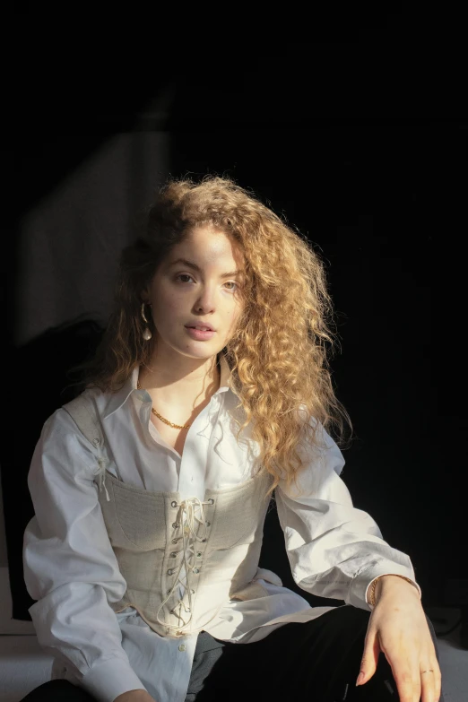a woman in a white shirt and black pants, an album cover, inspired by Elsa Bleda, unsplash, renaissance, curly blonde hair | d & d, portrait sophie mudd, done in the style of caravaggio, portrait of the actress
