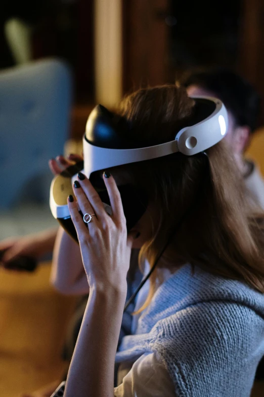 a woman using a virtual reality headset in a living room, by David Simpson, reddit, close-up shot taken from behind, unreal engine tech demo, wearing gaming headset, brown