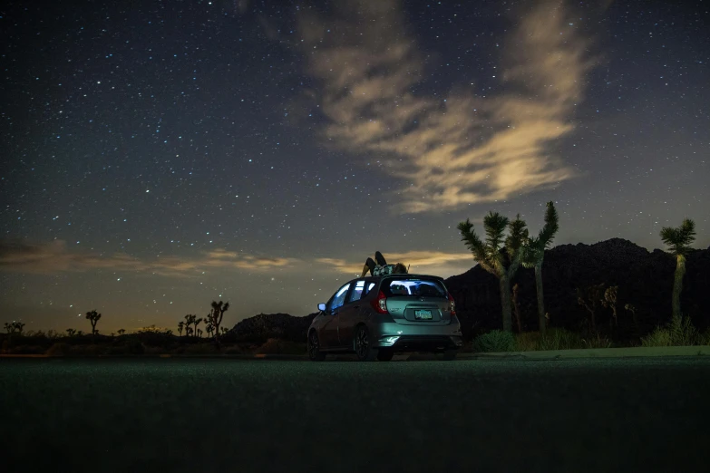 a car parked on the side of a road under a night sky, mojave desert, subaru, gazing off into the horizon, detailing