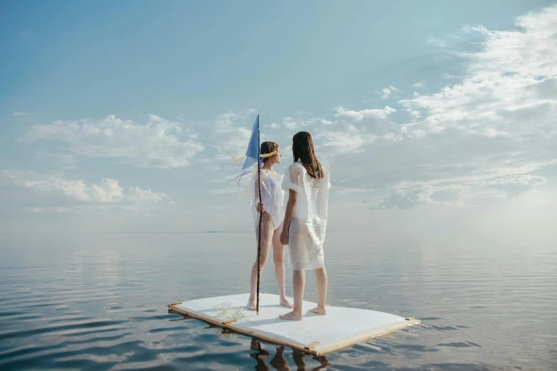 a couple of women standing on top of a boat, unsplash contest winner, conceptual art, float, summer day, rectangular piece of art, julia sarda