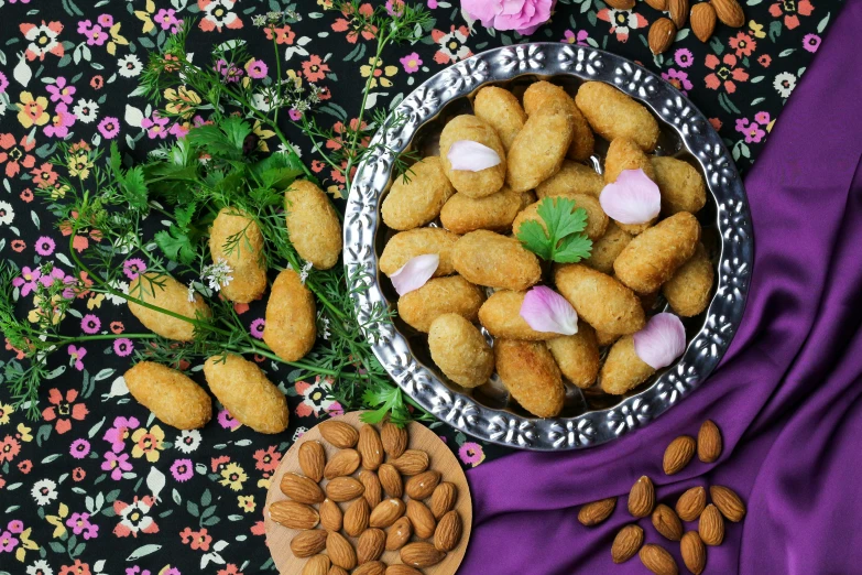 a bowl filled with almonds next to a plate of almonds, an album cover, by Julia Pishtar, dau-al-set, background image, snacks, nugget, moroccan