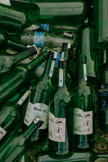 a bunch of bottles sitting next to each other, by Adam Marczyński, pexels, thin green glassy crystal shards, post-war, scattered rubbish, promo image