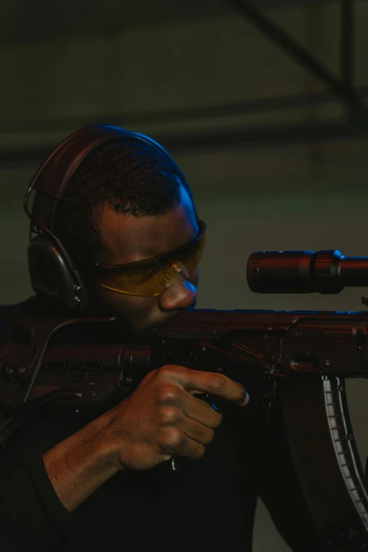 a close up of a person holding a rifle, frank ocean, radio goggles, performance, **cinematic