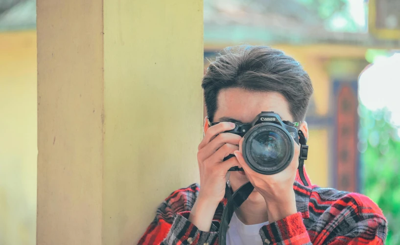 a man taking a picture with a camera, pexels contest winner, photorealism, lovingly looking at camera, coloured photo, youtuber, telephoto