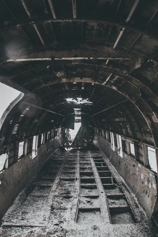 the inside of an old abandoned train car, by Will Ellis, unsplash contest winner, auto-destructive art, airplane in the sky, burned, aircraft wings on back, portrait featured on unsplash