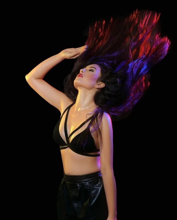 a woman with her hair blowing in the wind, an album cover, by Robbie Trevino, trending on pexels, holography, posing together in bra, dark. studio lighting, black red long hair!, pose 4 of 1 6