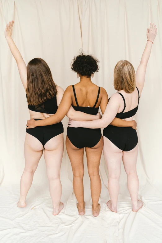 a group of women standing next to each other, by Jessie Alexandra Dick, unsplash, renaissance, black underwear, rear facing, t pose, three women