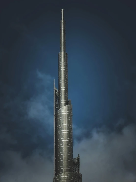 a very tall building in the middle of a city, dubai, made of brushed steel, 8k fine art photography, 2022 photograph