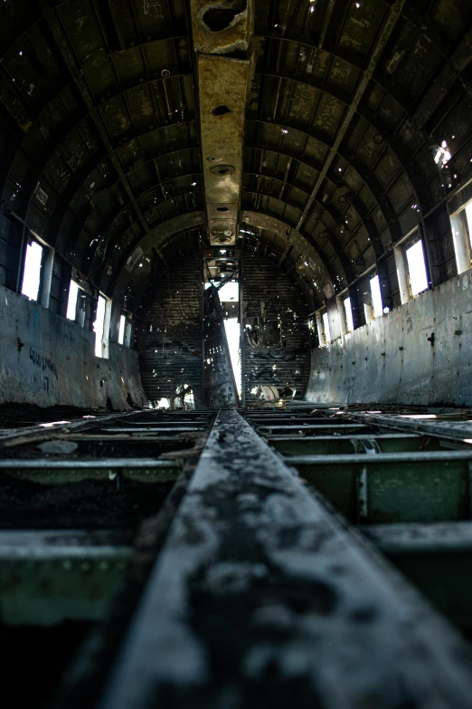 the inside of an old abandoned train car, an album cover, unsplash, on aircraft carrier, destroyed church, july 2 0 1 1, afar